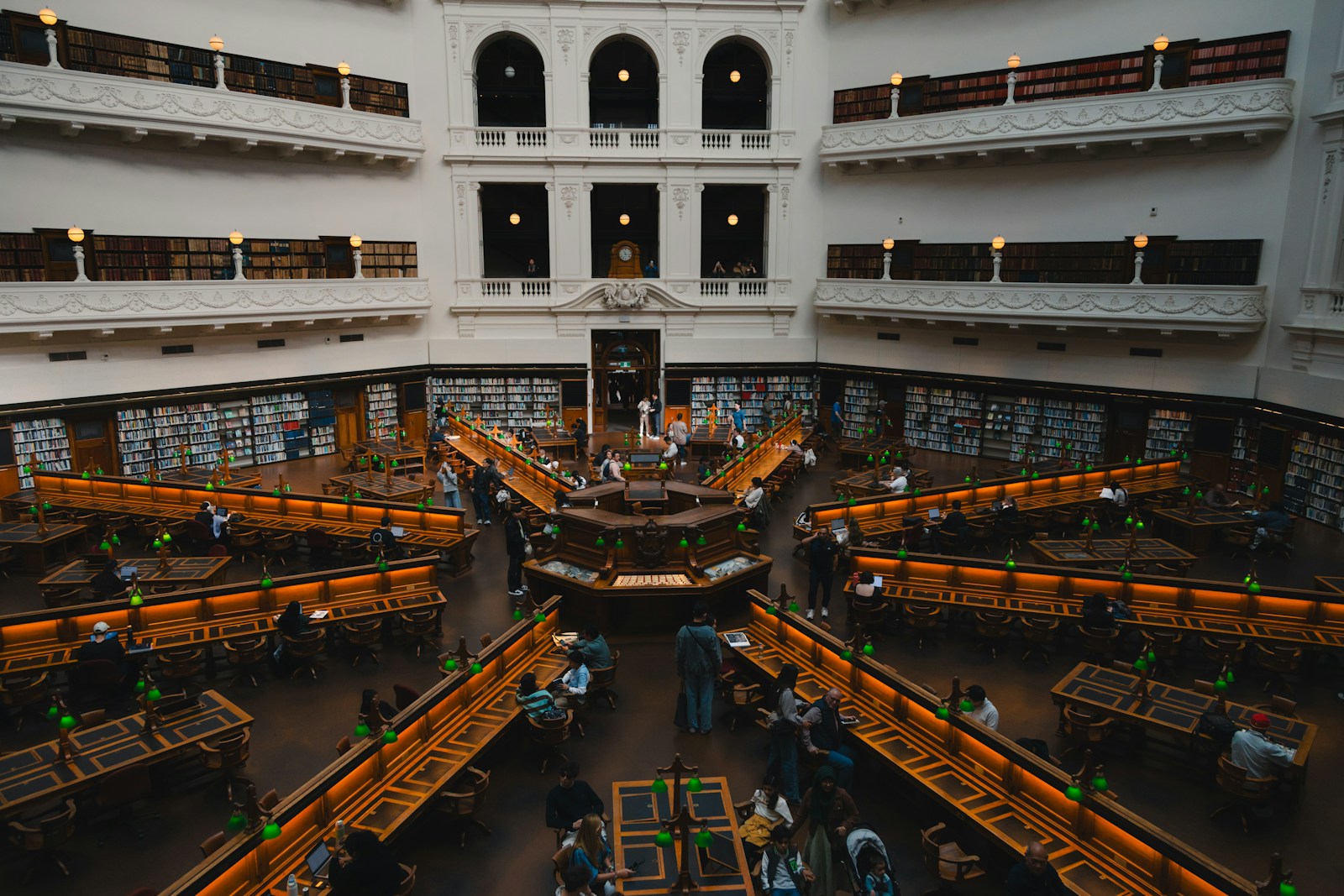 Traders working the floor of a stock exchange beneath display boards