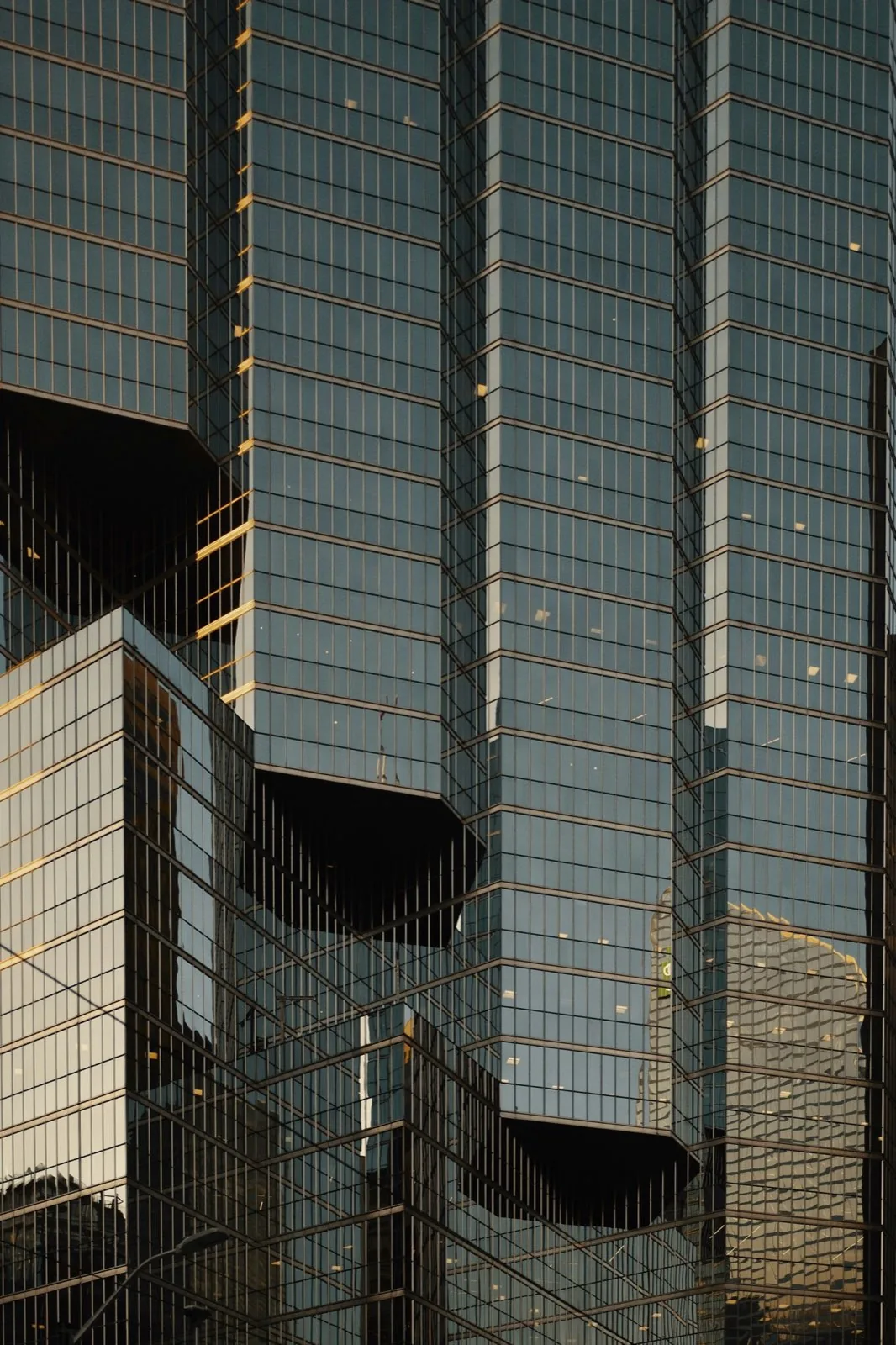 Glass office towers reflecting late-afternoon light